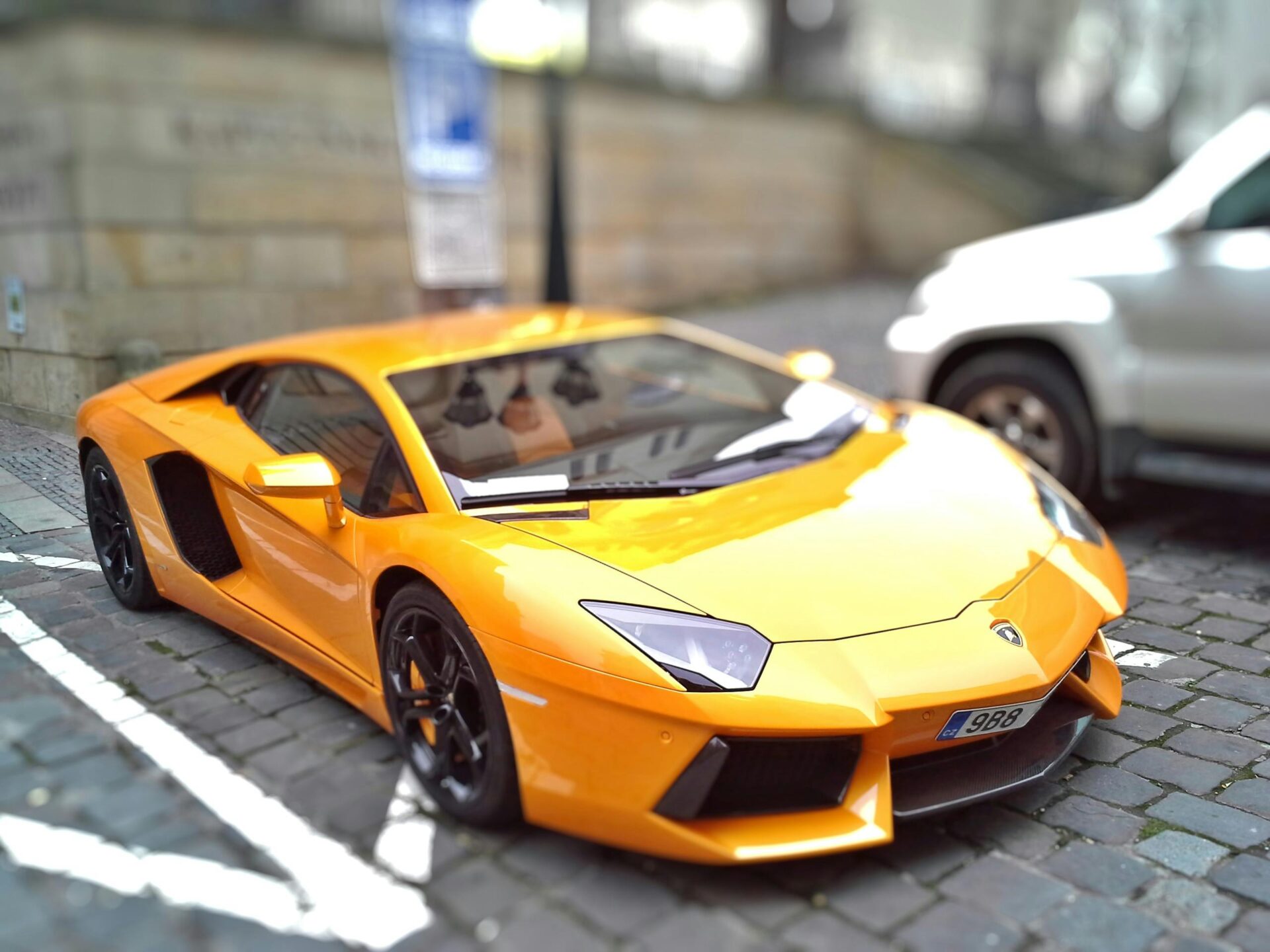 yellow-sports-car-during-day-time