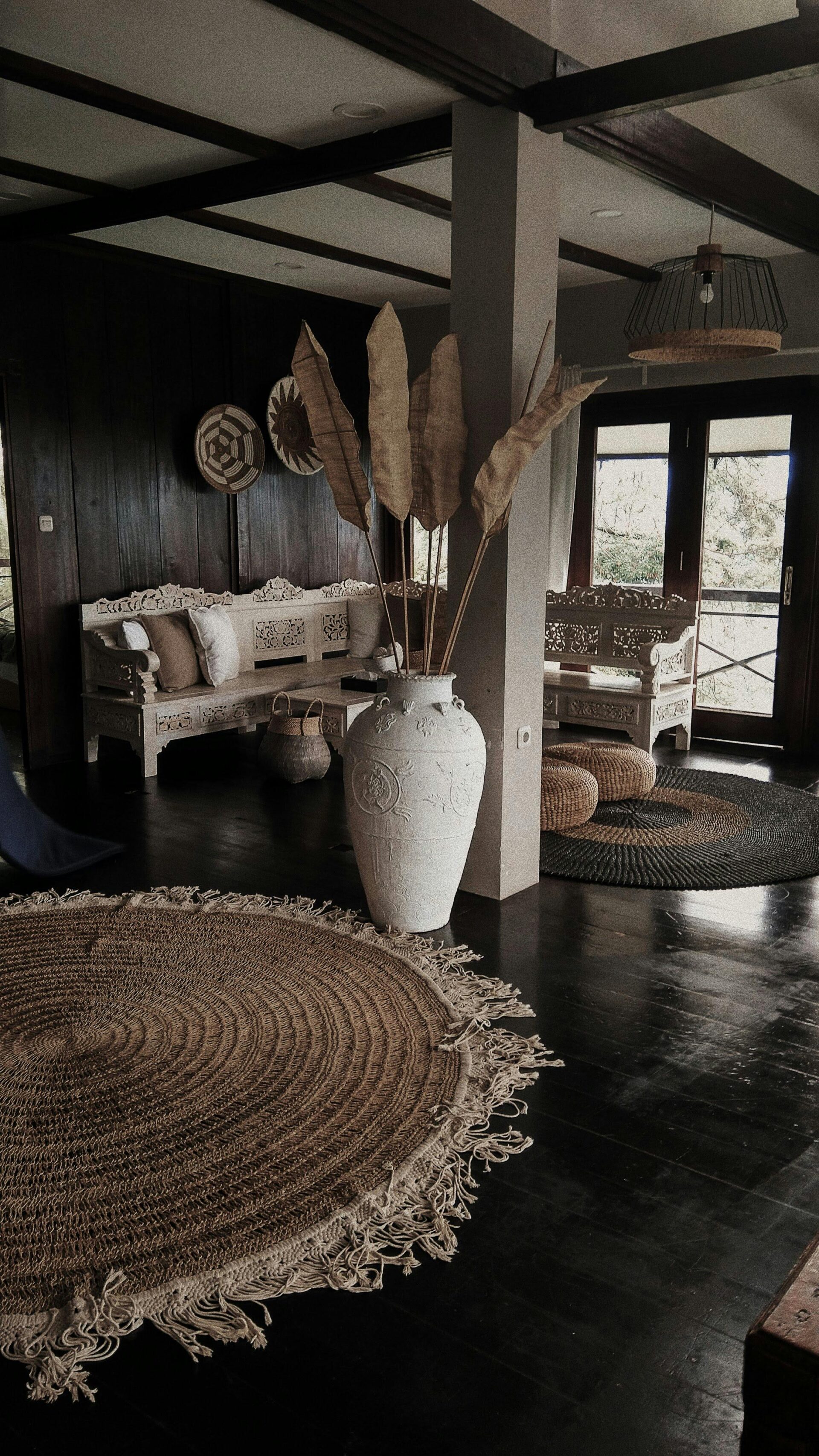 white-ceramic-vase-on-brown-wooden-floor