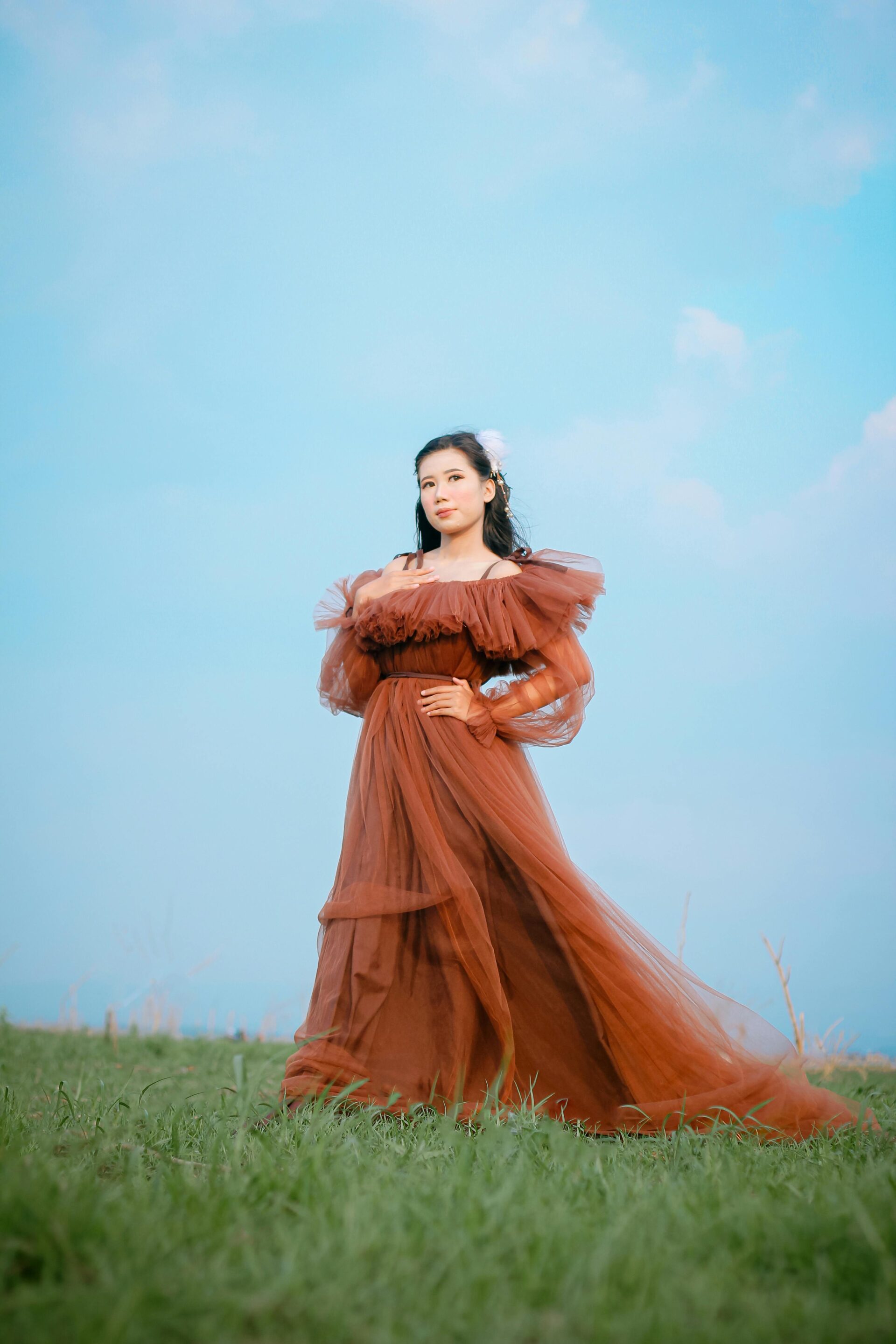 elegant-woman-in-flowing-dress-outdoors