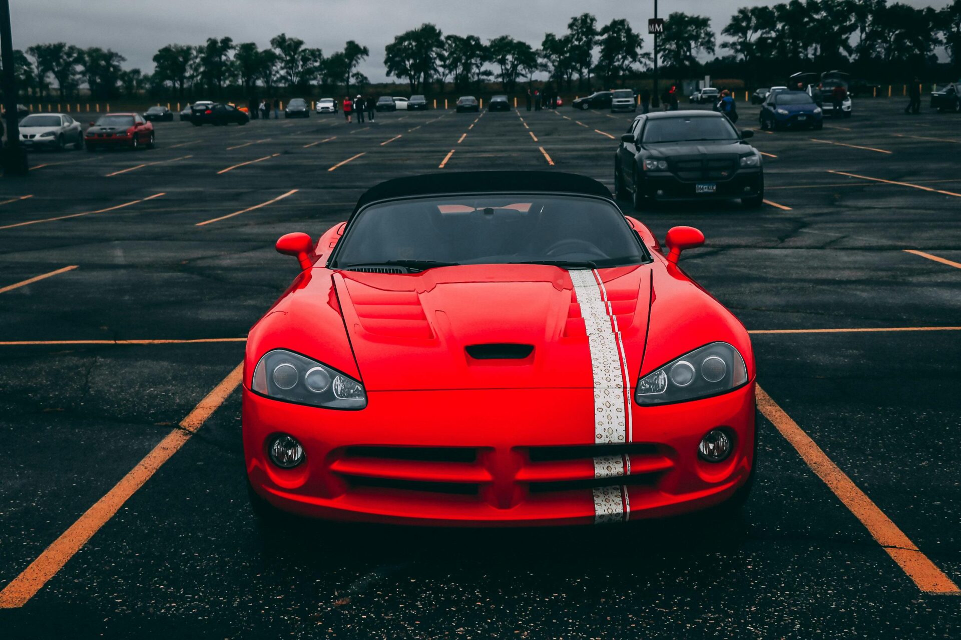 red-convertible-coupe-on-black-surface