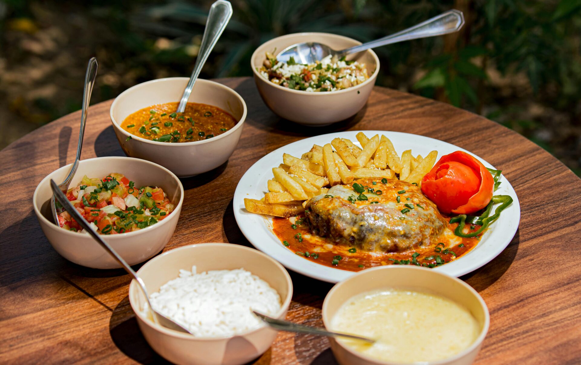 delicious-variety-of-dishes-on-wooden-table