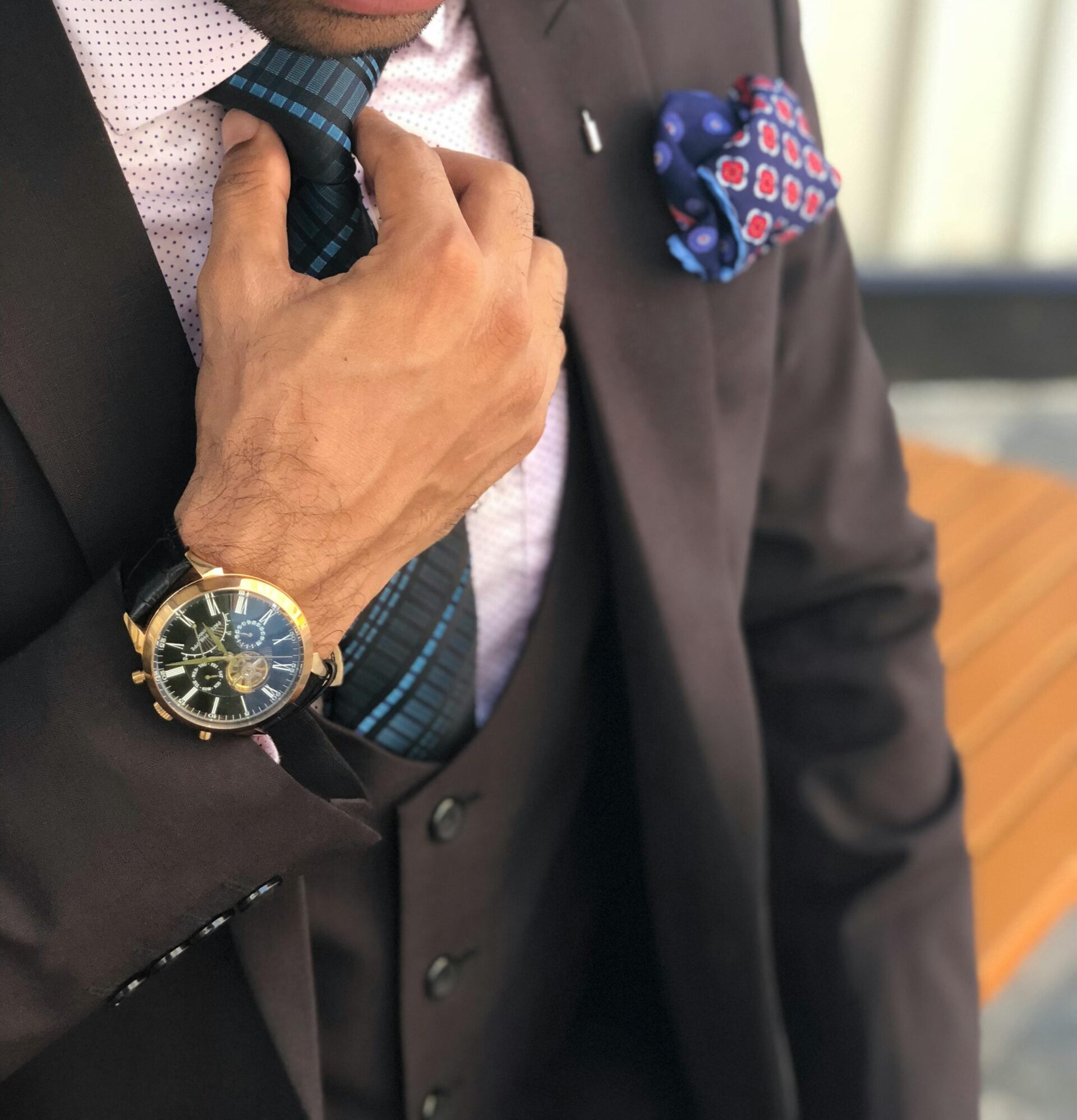 man-in-formal-suit-jacket-holding-his-necktie